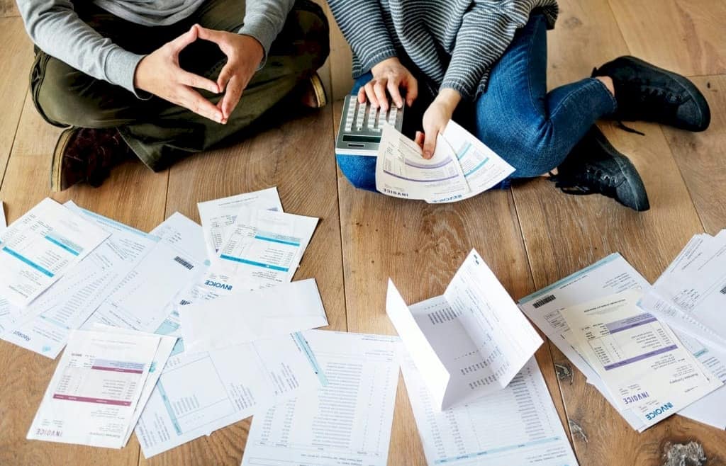 Couple stresses over multiple bills, considering debt consolidation loan