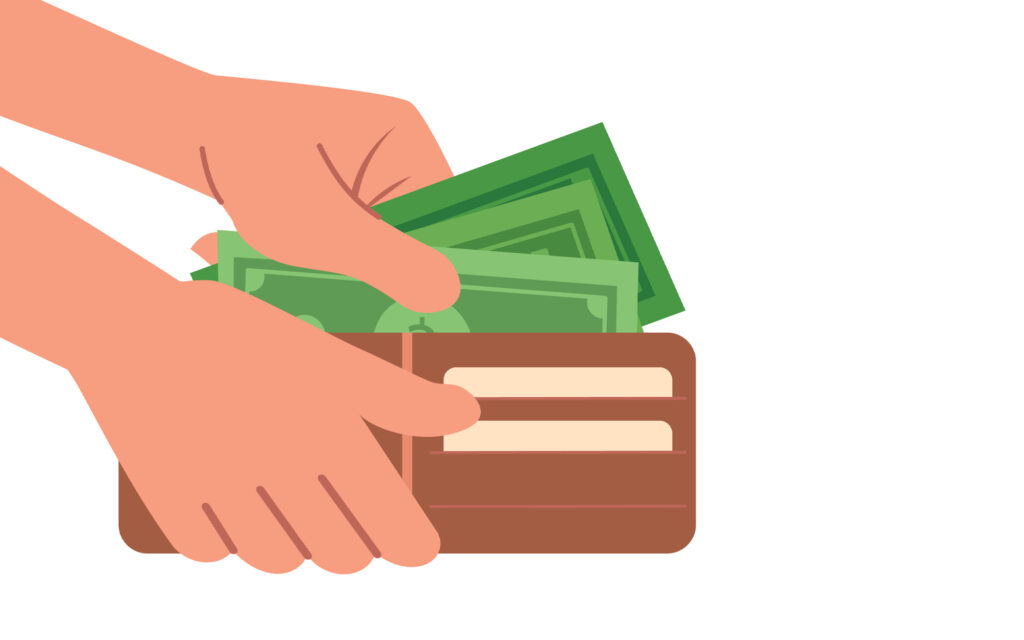 Person adding cash to wallet—extra funds made possible with a winter personal loan from Loansmart.