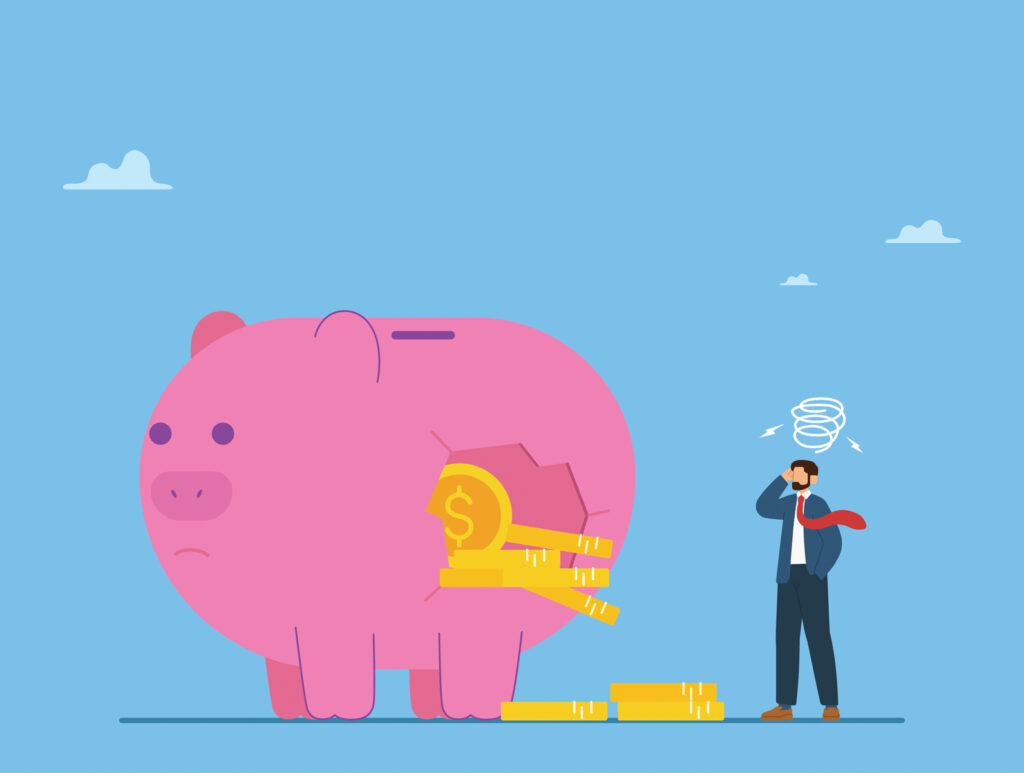 Broken piggy bank losing money, illustrating poor financial habits and unexpected financial pressure.